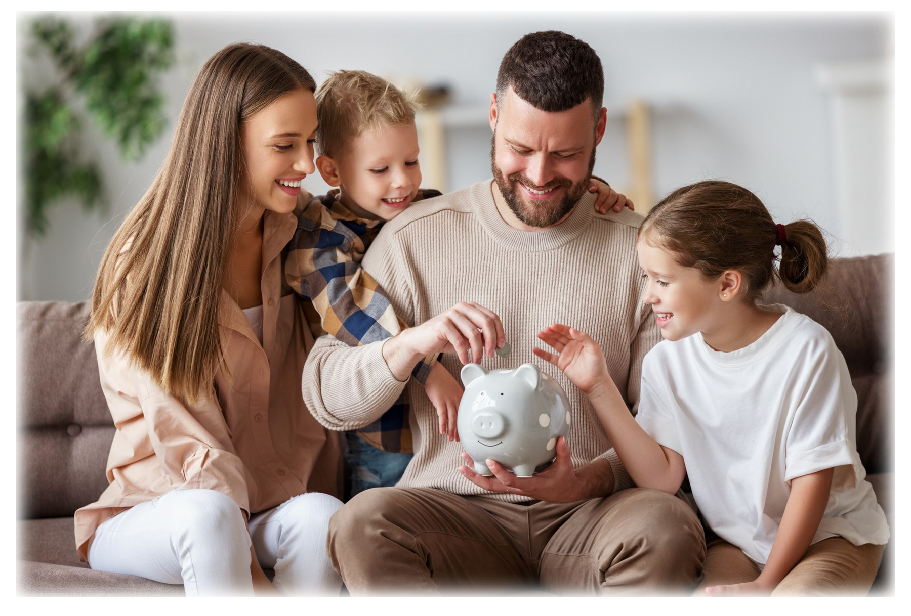 Family sitting together on the couch putting money into a piggy bank